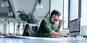 AR Automation man sitting at computer