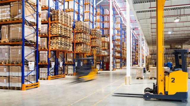 zoomed out image of a forklift in a warehouse