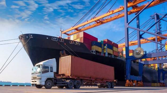 Container ship and shipping truck at a port