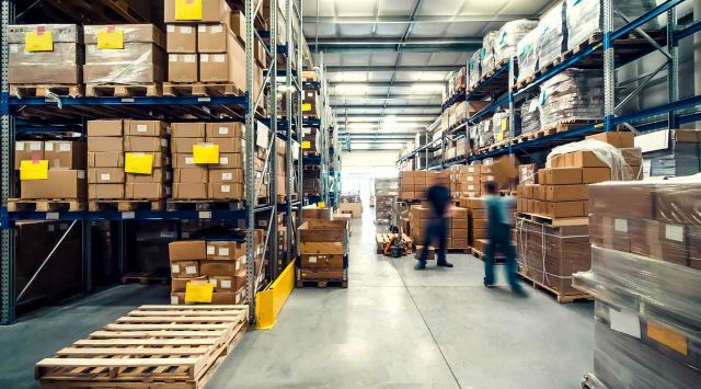 Warehouse workers moving boxes